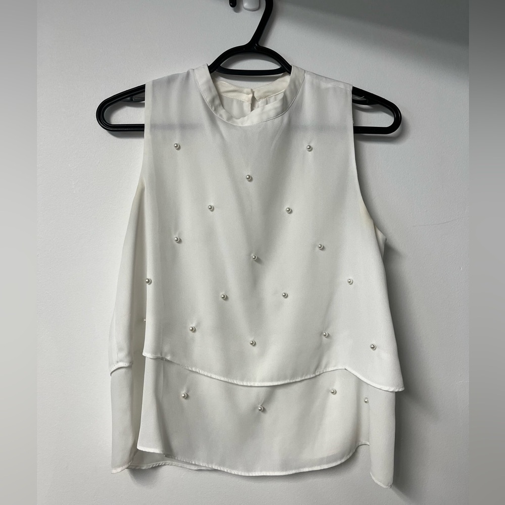 Chic Sleeveless White Blouse with Pearl Details